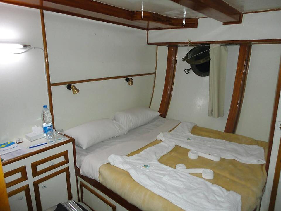 Double cabin with porthole aboard SY Mermaid